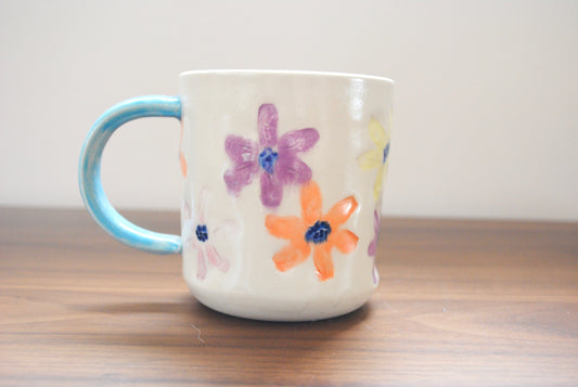 blue handle flower mug