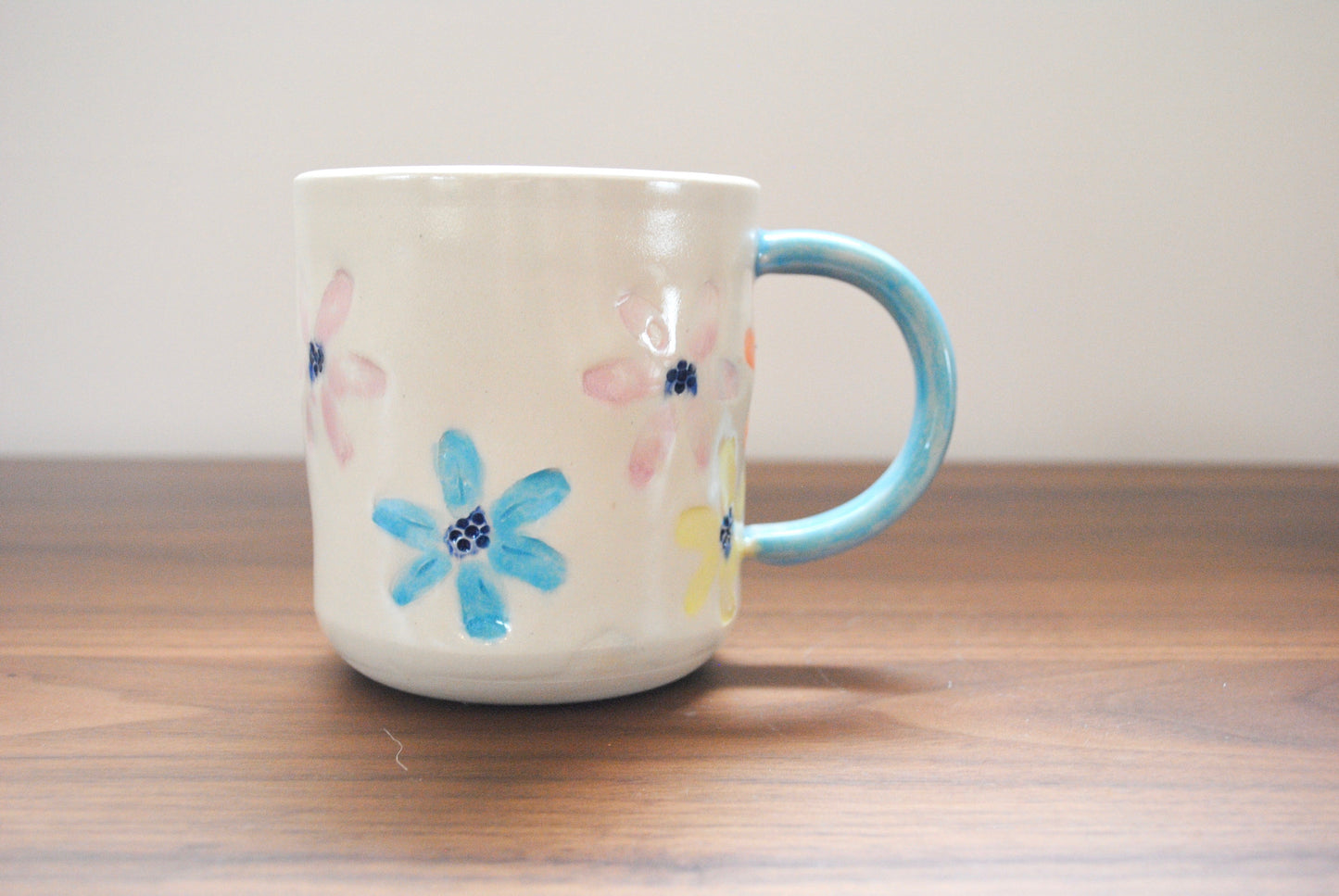 blue handle flower mug